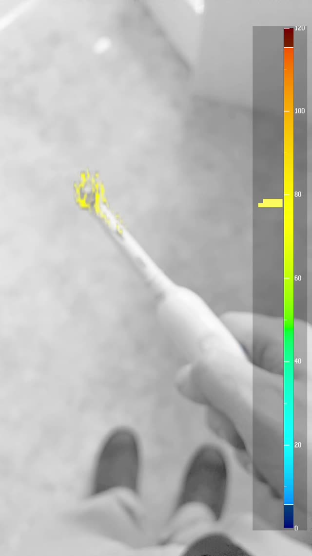 VibraLens live view: an electric toothbrush head painted yellow by the vibration overlay, reading about 78 Hz on the 0–120 Hz color legend